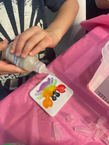 Child playing with squishy elf creations instead of a tablet