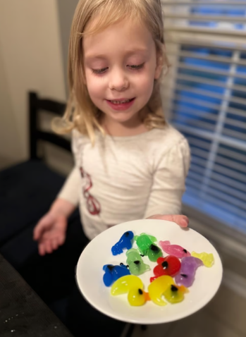 Child showing off a homemade water elf